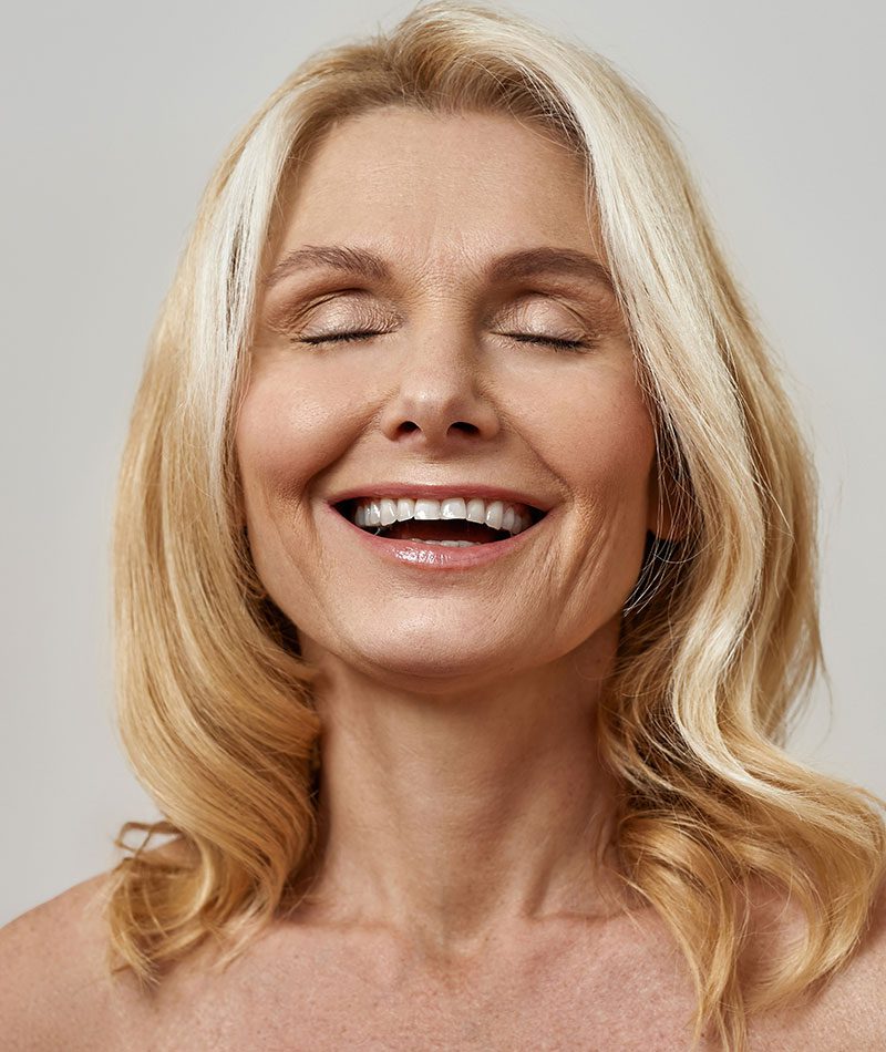 Laughing middle aged woman