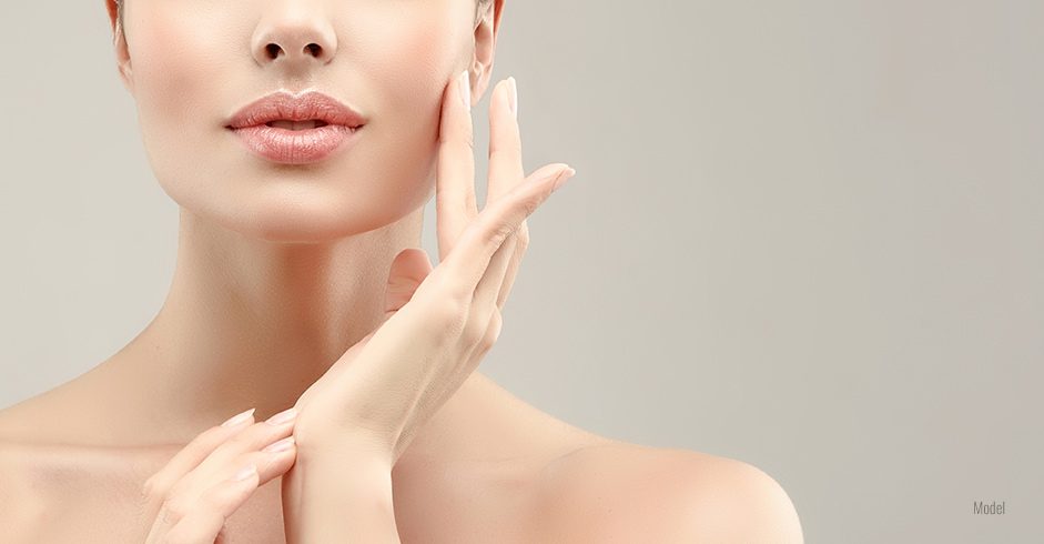 A cropped shot showing the firm, glowing skin on the cheeks, jaw, and neck of a beautiful woman.